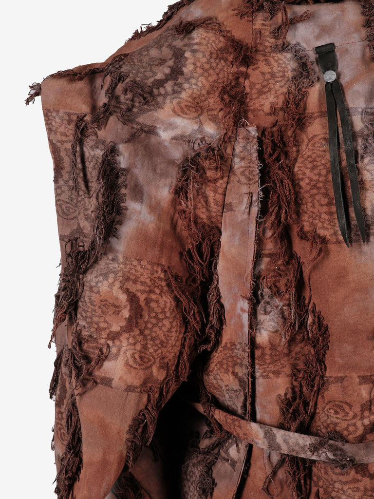 Hand-dyed cotton jacket with fringe and a belt.