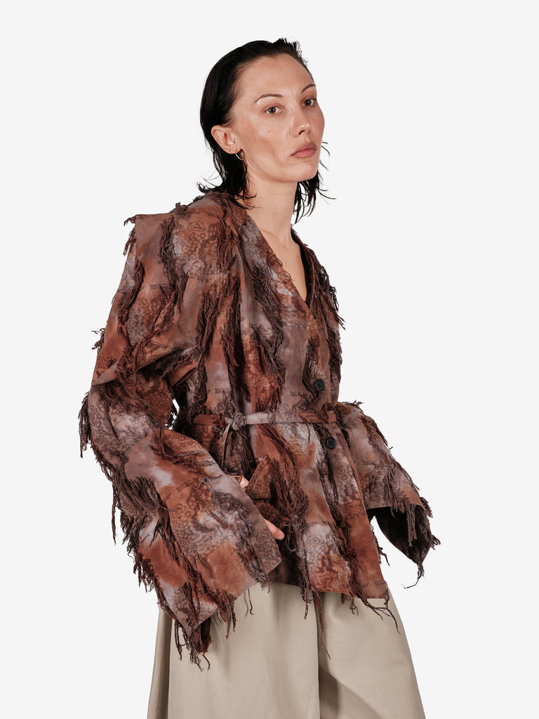 Hand-dyed cotton jacket with fringe and a belt.