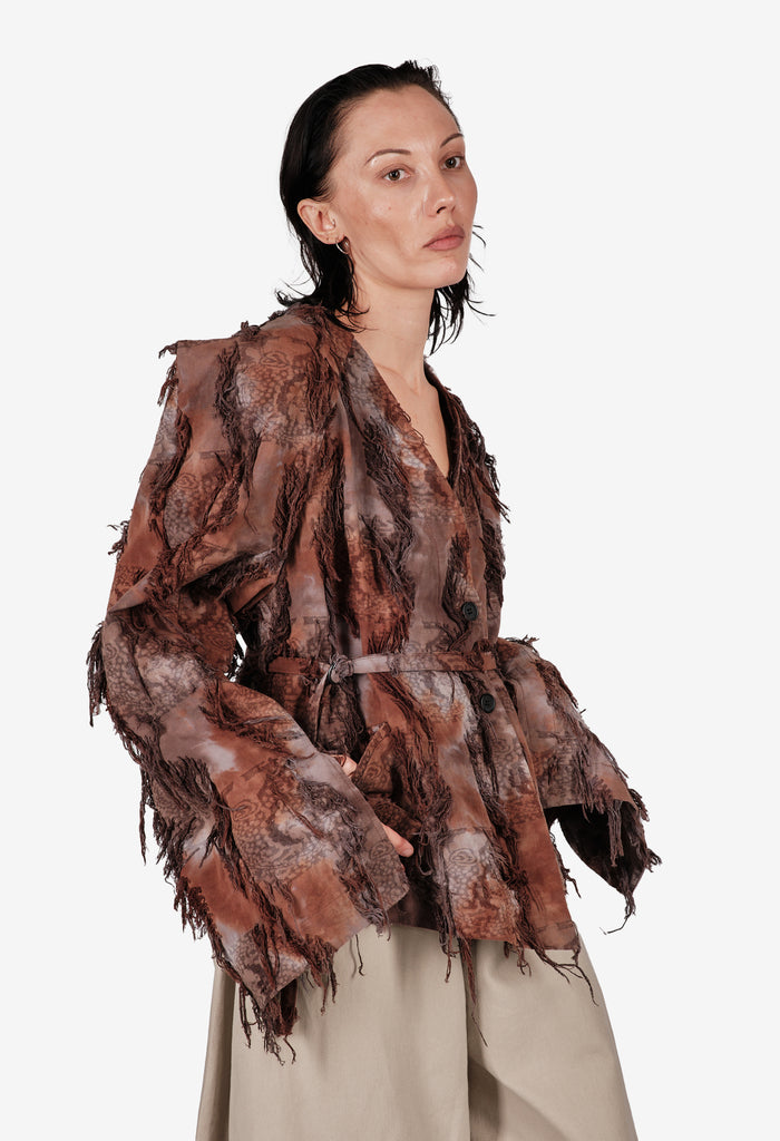 Hand-dyed cotton jacket with fringe and a belt.
