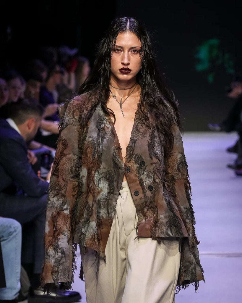 Hand-dyed cotton jacket with fringe and a belt.